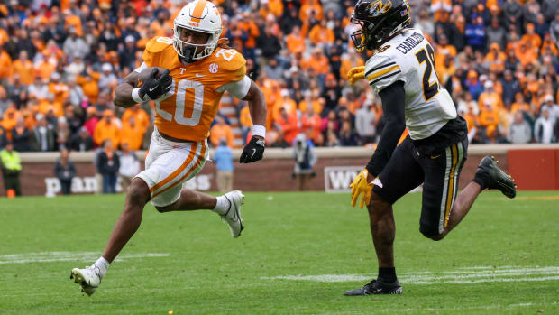 Nov 12, 2022; Knoxville, Tennessee, USA; Tennessee Volunteers running back Jaylen Wright (20) runs the ball against Missouri Tigers defensive back Joseph Charleston (28) during the second half at Neyland Stadium. Mandatory Credit: Randy Sartin-USA TODAY Sports